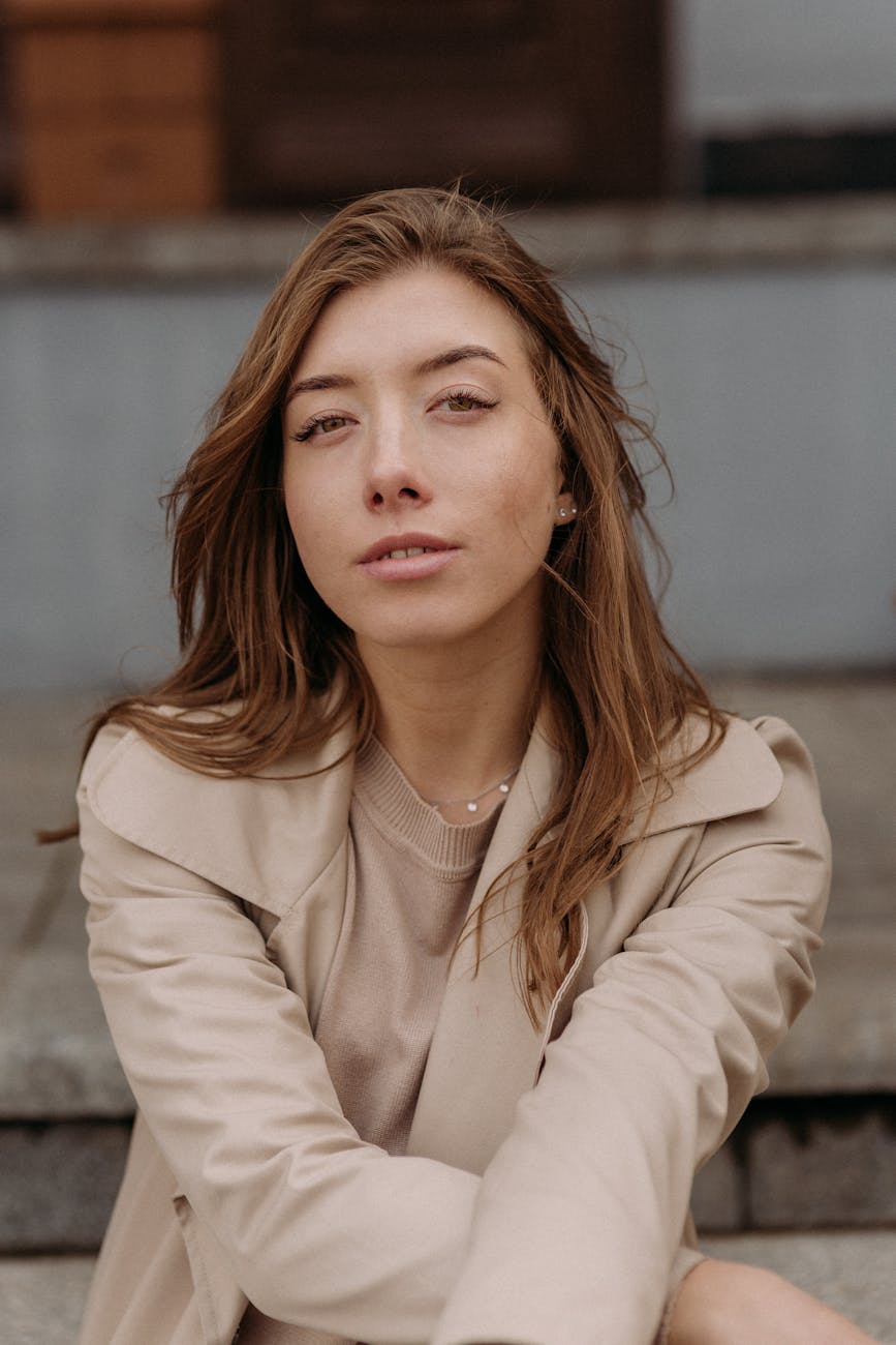 Person stretching outdoors with a serene natural landscape in the background.
